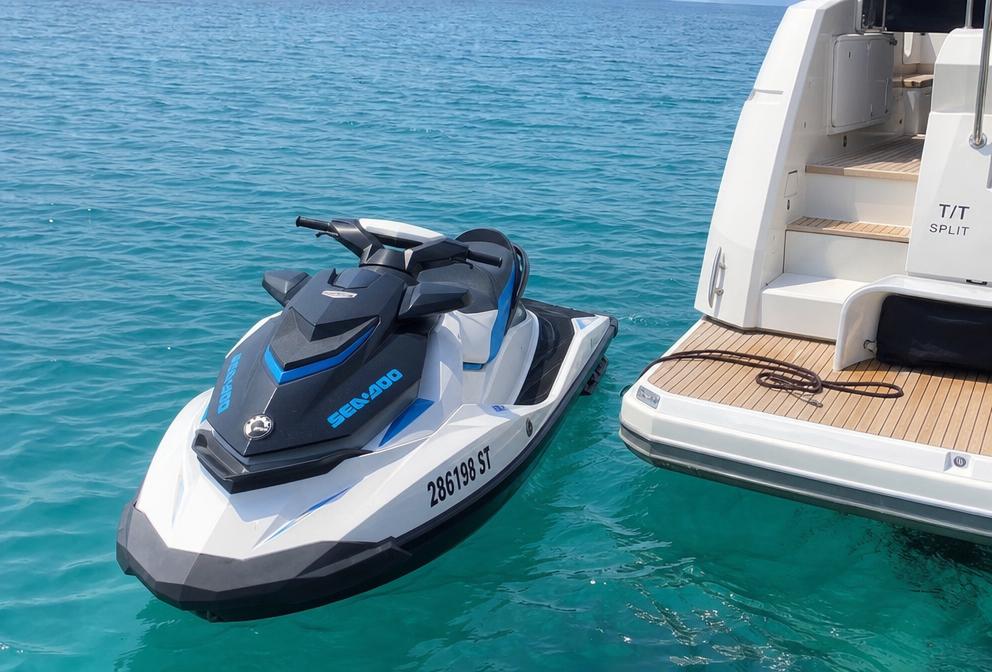 Jet ski moored beside a yacht