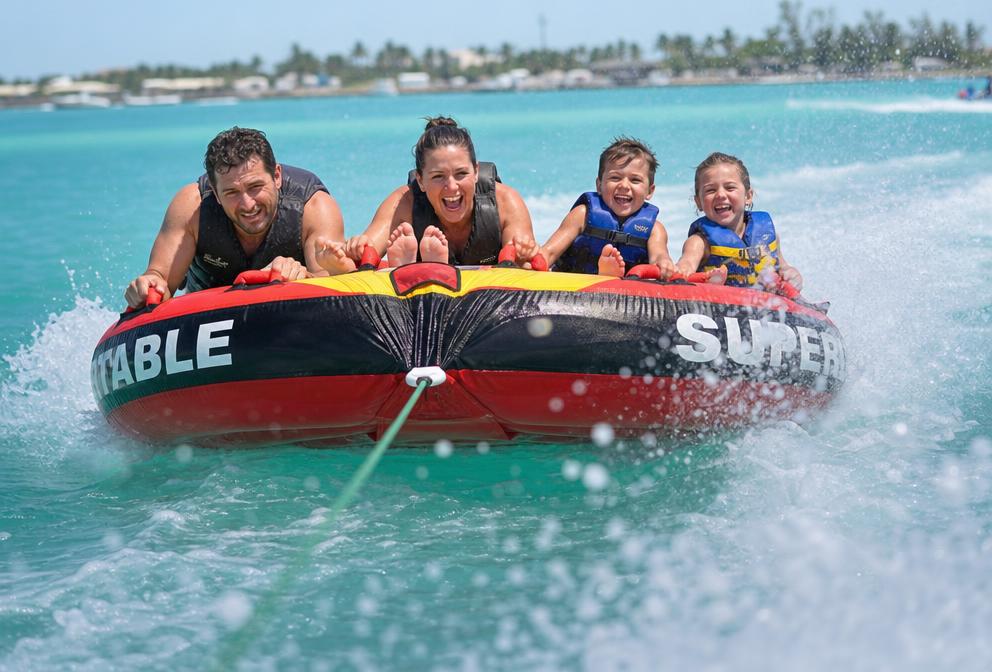 Inflatable towable ring behind a boat